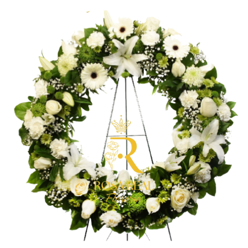 Corona mixta de flores frescas con atril, compuesta por rosas, lirios, claveles y margaritas, ideal para ceremonias de homenaje y tributos florales